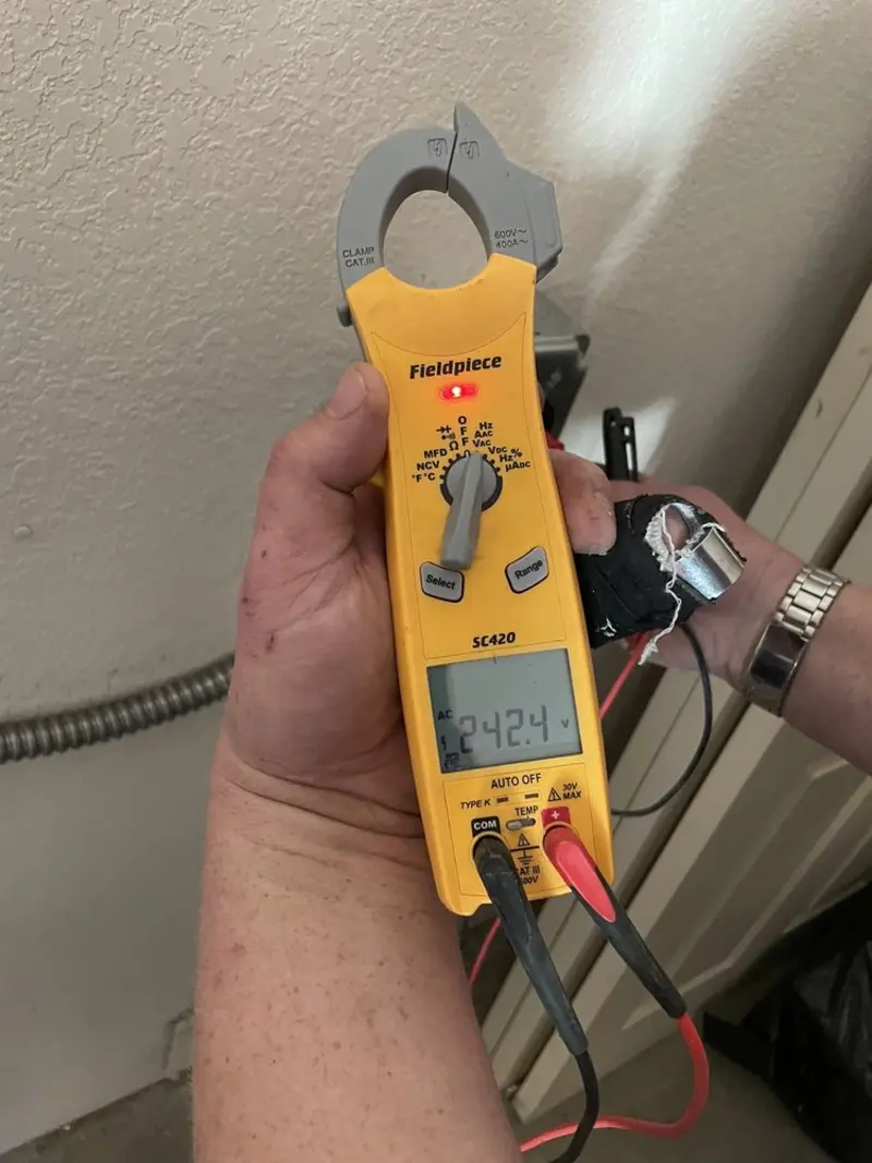 Voltage testing with clamp meter during Aluminum Wiring Replacement in Booneville